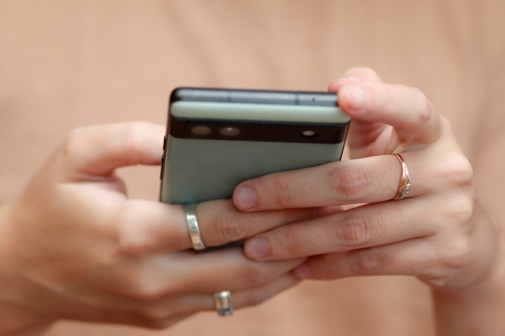 hands holding a phone